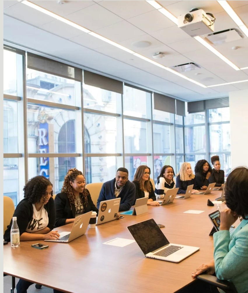 A group of professionals seated around a conference table